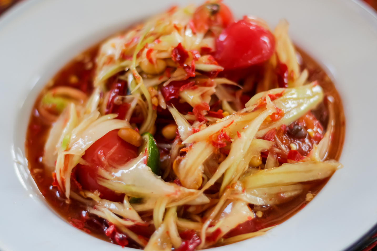 Food of Thailand with som tam or papaya salad.